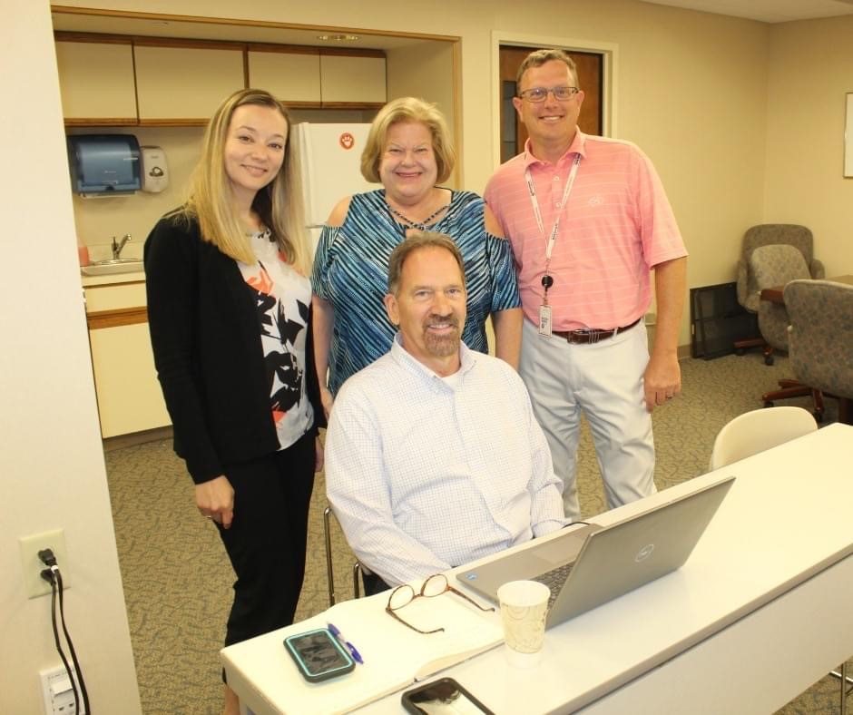 Nicole Pineault posing with Rhode Island Blood Center staff.