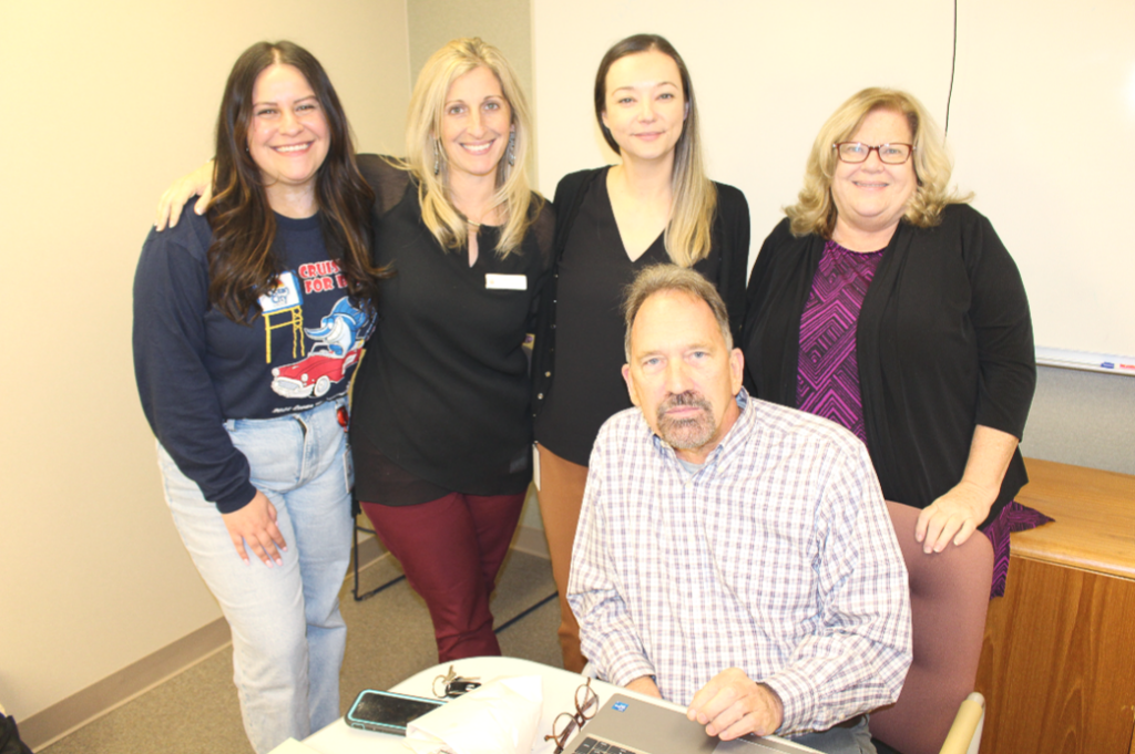 Nicole Pineault posing with Rhode Island Blood Center staff.