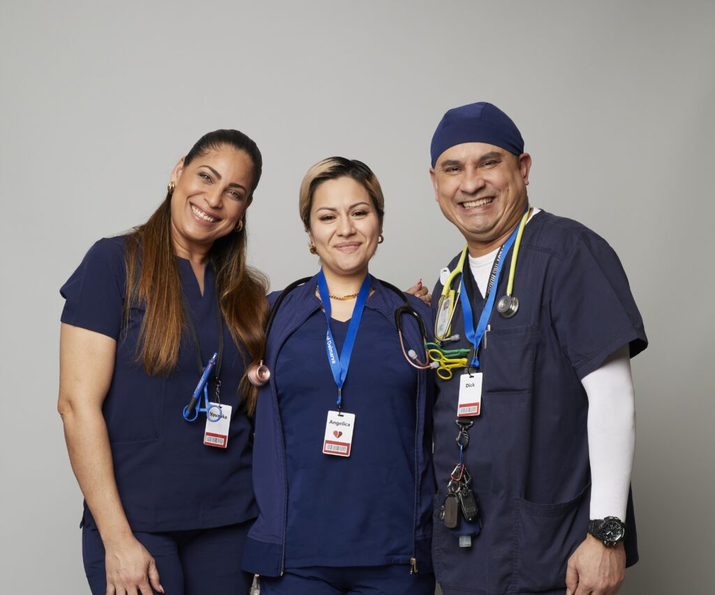 Three smiling BBD phlebotomists at a blood drive.