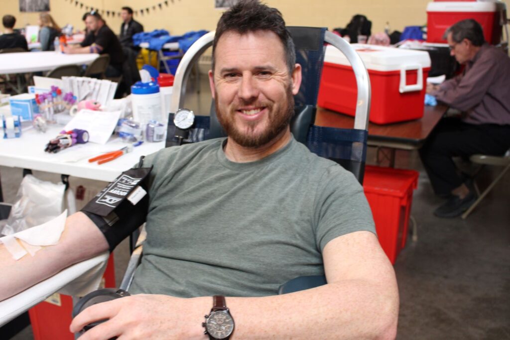 Blood donor in chair.